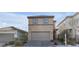 Inviting two-story home showcasing a well-manicured front yard and attached garage at 5398 Pico Viejo St, Las Vegas, NV 89166