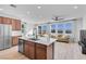 Modern kitchen with stainless steel appliances, island sink, and open layout perfect for entertaining guests at 5398 Pico Viejo St, Las Vegas, NV 89166