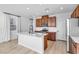 Well-lit kitchen featuring a large center island, modern appliances, and sleek cabinetry for an elegant cooking space at 5398 Pico Viejo St, Las Vegas, NV 89166