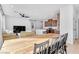 Spacious open-concept living area with dining table and modern kitchen, perfect for modern living and entertaining at 5398 Pico Viejo St, Las Vegas, NV 89166