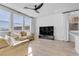 Contemporary living room with a large TV and comfortable seating, perfect for entertaining and relaxation at 5398 Pico Viejo St, Las Vegas, NV 89166