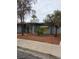 Charming single-story home featuring desert landscaping, concrete walkway, and trees at 569 Canosa Ave, Las Vegas, NV 89104