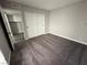 Bedroom with carpeted floor and a sliding-door closet with light-gray walls at 5720 Goldmount Ave, Las Vegas, NV 89107