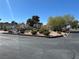 Well-maintained landscaping with mature trees, shrubs, and manicured flowerbeds creates a visually appealing outdoor space at 5720 Goldmount Ave, Las Vegas, NV 89107