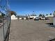 Spacious parking area with ample room for vehicles and boats, secured with a chain-link fence at 5720 Goldmount Ave, Las Vegas, NV 89107
