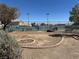 Community tennis court featuring benches and nearby landscaping for relaxing and enjoying the outdoors at 5720 Goldmount Ave, Las Vegas, NV 89107