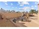 Enjoy outdoor living in this backyard featuring an outdoor dining area, grill, and desert landscaping at 59 Desert Dawn Ln, Henderson, NV 89074