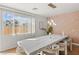 Bright dining area with large window and stylish stone table at 59 Desert Dawn Ln, Henderson, NV 89074