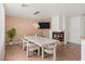 Spacious dining area with fireplace, TV, and seating for Gathering and friends at 59 Desert Dawn Ln, Henderson, NV 89074
