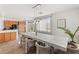 Bright kitchen-dining area with island, stainless appliances, and natural light at 59 Desert Dawn Ln, Henderson, NV 89074