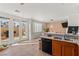Charming eat-in kitchen featuring tile floors, stainless steel appliances, and lots of natural light at 59 Desert Dawn Ln, Henderson, NV 89074
