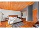 A well lit main bedroom featuring wood ceiling, textured walls, and stylish rug at 59 Desert Dawn Ln, Henderson, NV 89074
