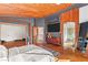 Bright main bedroom boasts wood ceiling, textured wall, and wall mounted TV at 59 Desert Dawn Ln, Henderson, NV 89074