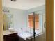 Well-lit bathroom features separate tub and shower with tile surround and wood-look blind at 6245 Blushing Willow St, North Las Vegas, NV 89081
