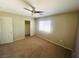 Bedroom featuring ceiling fan, carpeted floors, and a closet for ample storage space at 6245 Blushing Willow St, North Las Vegas, NV 89081