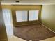 Inviting living room featuring carpeted floors and ample natural light from the windows at 6245 Blushing Willow St, North Las Vegas, NV 89081