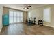 Bonus room featuring exercise equipment, refrigerator, and wood-look tile flooring at 6403 Brandon Hills Ct, Las Vegas, NV 89139