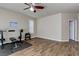 Bonus room featuring exercise equipment and wood-look tile flooring and white baseboards at 6403 Brandon Hills Ct, Las Vegas, NV 89139