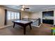 Spacious game room has an air hockey table, custom cabinets and iron railing overlooking downstairs at 6403 Brandon Hills Ct, Las Vegas, NV 89139