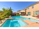 Inviting backyard pool with a spa, lush landscaping and patio space for entertaining at 6403 Brandon Hills Ct, Las Vegas, NV 89139