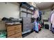 This walk-in closet has lots of storage with shelving and drawers for clothing, shoes, and accessories at 6403 Brandon Hills Ct, Las Vegas, NV 89139