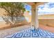 Backyard featuring a brick patio and a large shaded area at 6711 Quarterhorse Ln, Las Vegas, NV 89148