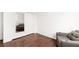 Bedroom with a mirrored closet, modern chair, and sleek wood flooring at 6711 Quarterhorse Ln, Las Vegas, NV 89148