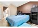 Spacious main bedroom features a large bed, neutral walls, and modern fixtures at 6711 Quarterhorse Ln, Las Vegas, NV 89148