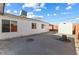 Spacious backyard with a concrete patio, gravel landscaping, and a storage shed at 704 Slayton Dr, Las Vegas, NV 89107