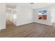 Bright bedroom with vinyl floors and a large window offering natural light at 704 Slayton Dr, Las Vegas, NV 89107