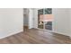 Bedroom featuring sliding glass doors to the backyard, vinyl floors, and a closet at 704 Slayton Dr, Las Vegas, NV 89107