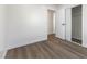 Bedroom with vinyl floors, closet, and a view into the hallway at 704 Slayton Dr, Las Vegas, NV 89107