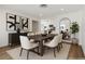 Dining room boasts modern decor and abundant seating for dinner parties at 704 Slayton Dr, Las Vegas, NV 89107