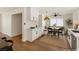 Bright kitchen features new white cabinets, stainless steel appliances, and breakfast nook area at 704 Slayton Dr, Las Vegas, NV 89107