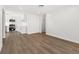 Open living room offers views to updated kitchen with stainless steel appliances at 704 Slayton Dr, Las Vegas, NV 89107