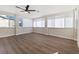 Sunroom offers large windows, ceiling fan and neutral flooring at 704 Slayton Dr, Las Vegas, NV 89107