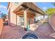 Enjoy the spacious backyard patio, featuring shade, greenery, and outdoor seating at 744 Forest Peak St, Henderson, NV 89011