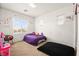 Bright bedroom with play area, natural light, and comfortable carpet at 744 Forest Peak St, Henderson, NV 89011