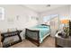 Comfortable bedroom with a full bed, side tables, and bright natural light at 744 Forest Peak St, Henderson, NV 89011