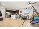 Bright kitchen with dark wood cabinets, granite countertops, stainless steel appliances and casual dining area at 744 Forest Peak St, Henderson, NV 89011