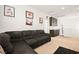 Comfortable living area with a large sectional sofa, perfect for relaxing and entertaining at 744 Forest Peak St, Henderson, NV 89011