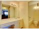 Bathroom vanity with mirror, lighting, and combined toilet/shower at 750 S Royal Crest Cir # 345, Las Vegas, NV 89169