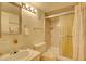 Cozy bathroom featuring a shower, updated vanity, and decorative mirror at 750 S Royal Crest Cir # 345, Las Vegas, NV 89169
