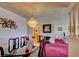 Elegant dining room with chandelier and views into other living spaces at 750 S Royal Crest Cir # 345, Las Vegas, NV 89169