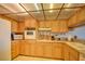 Well-maintained kitchen with wood cabinets and white appliances at 750 S Royal Crest Cir # 345, Las Vegas, NV 89169