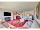 Spacious living room with a fireplace, TV, and seamless flow to other areas at 750 S Royal Crest Cir # 345, Las Vegas, NV 89169