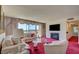 Comfortable living room with balcony, fireplace, TV, and stylish decor at 750 S Royal Crest Cir # 345, Las Vegas, NV 89169