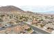 Neighborhood aerial view of homes showcasing desert landscaping and mountain views at 802 Blue Springs Dr, Henderson, NV 89002