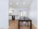 Bright dining area featuring a view to the backyard and open to the kitchen at 802 Blue Springs Dr, Henderson, NV 89002