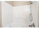 Clean bathroom with white tile shower-tub, handheld shower, and chrome fixtures at 8070 W Russell Rd # 2015, Las Vegas, NV 89113